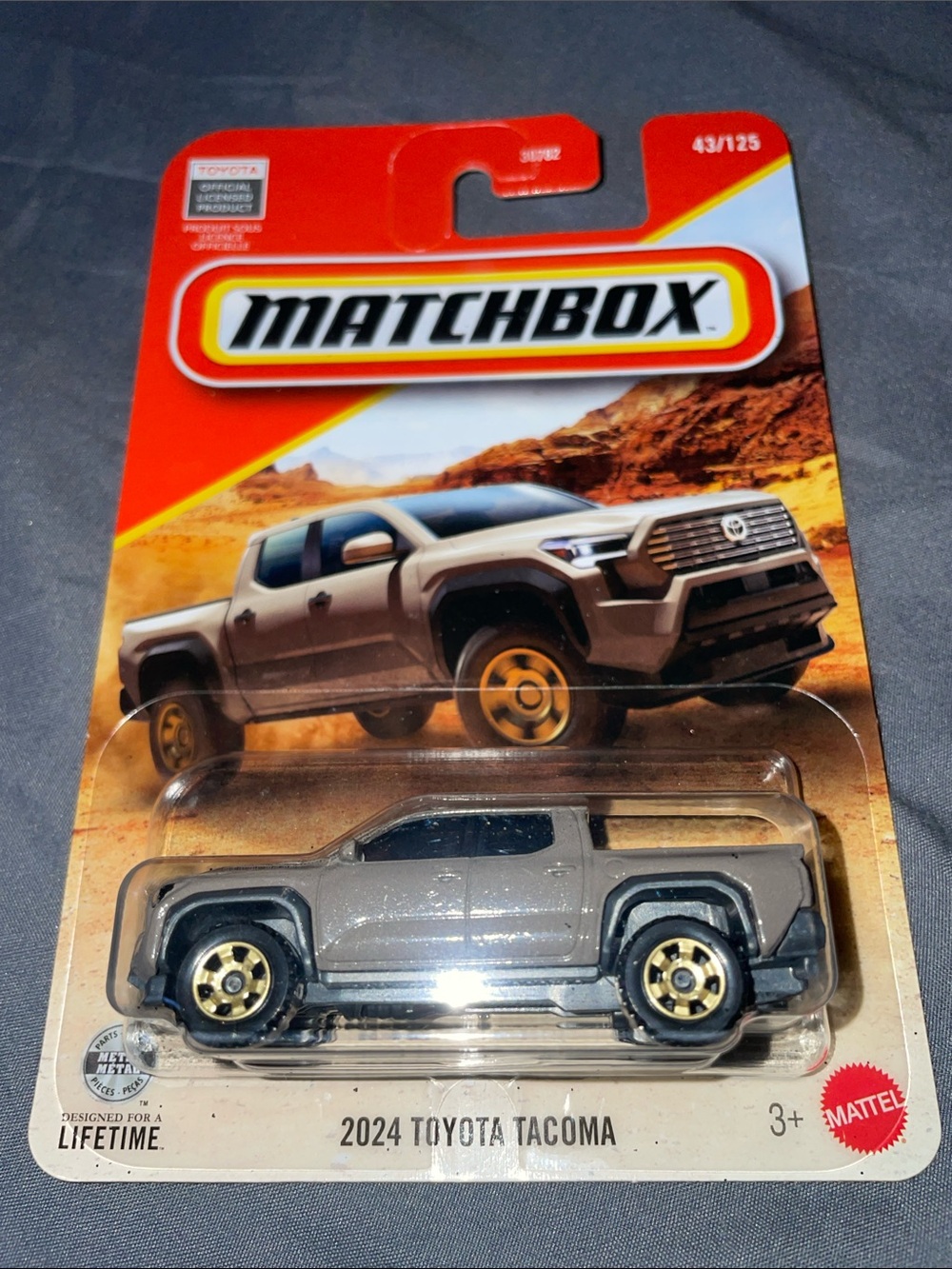 Matchbox 2024 Toyota Tacoma Toy Truck - Gray with Gold Wheels